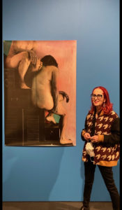 Helen Frajman standing next to a Janina Green print.